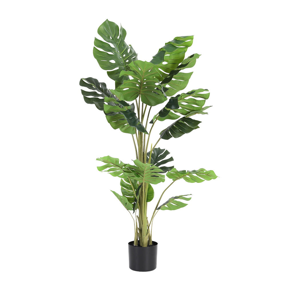 Artificial potted plant with large green leaves on a white background
