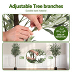 Adjustable tree branches with hands adjusting leaves, indoor setting.