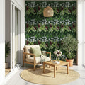 Outdoor patio with a living wall, wooden furniture, and a view of the ocean.