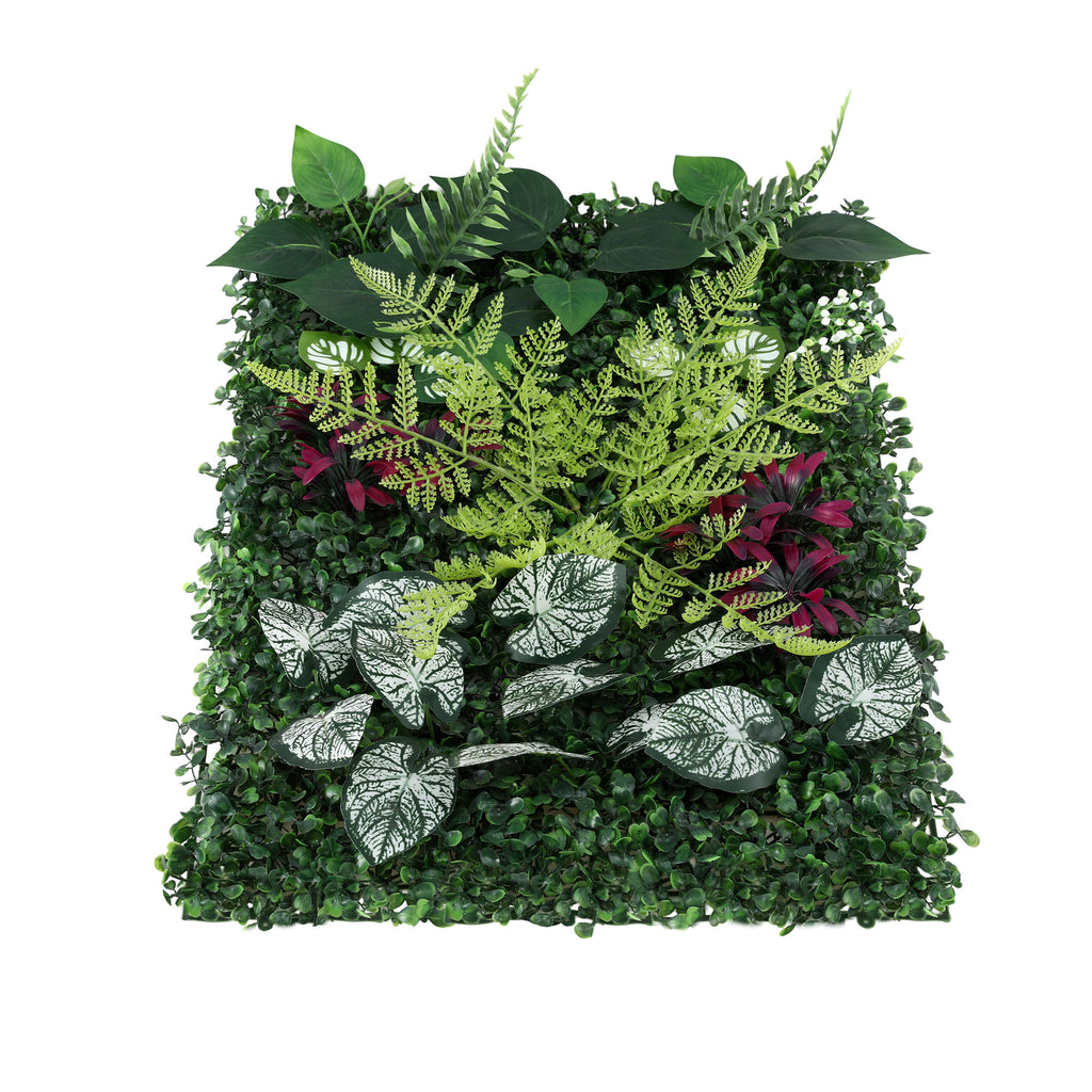 Artificial green wall with various plants and leaves on a white background