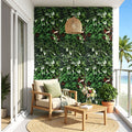 Outdoor patio with a wooden chair, table, and living wall with plants.