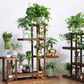Faux Flora 5-tier wooden plant stand with multiple shelves for indoor or outdoor display of artificial plants and decorative pots.
