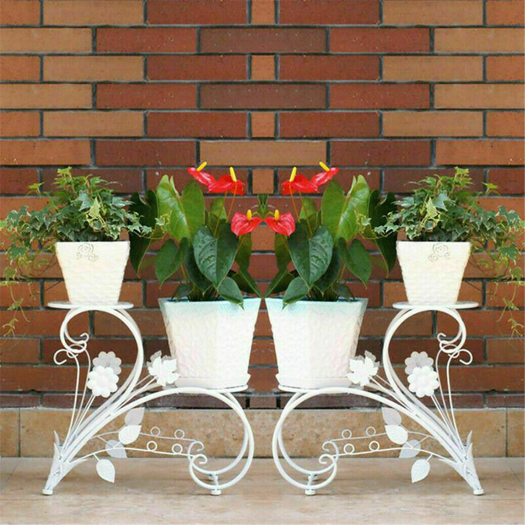 Pair of Faux Flora plant stand shelves with black metal frames and wooden shelves for indoor plant display.