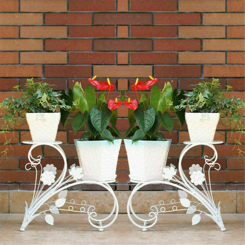 Pair of Faux Flora plant stand shelves with black metal frames and wooden shelves for indoor plant display.