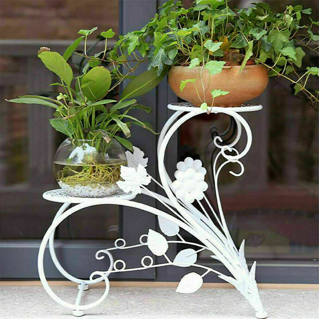 Set of two Faux Flora plant stand shelves with black metal frames and wooden shelves, designed for displaying artificial plants.