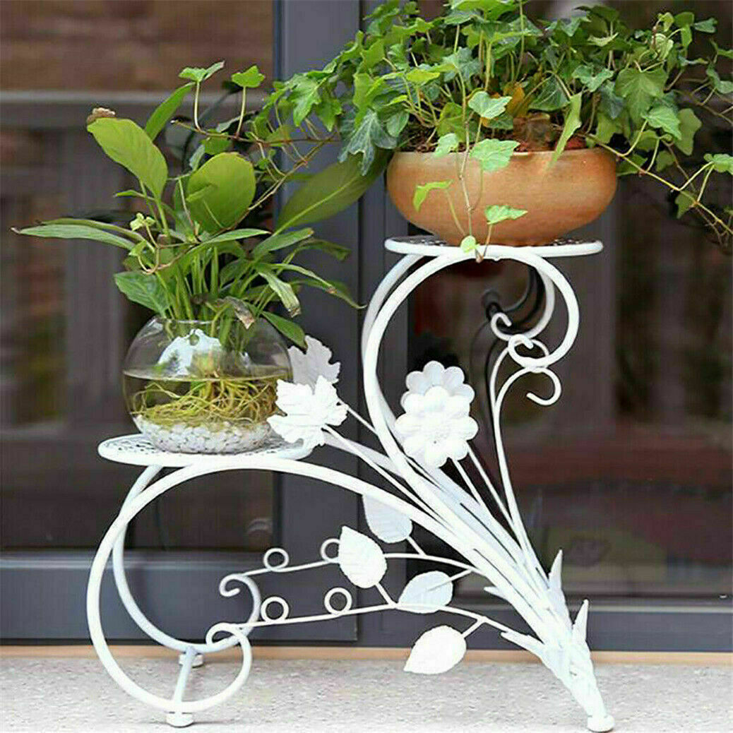 Set of two Faux Flora plant stand shelves with black metal frames and wooden shelves, designed for displaying artificial plants.