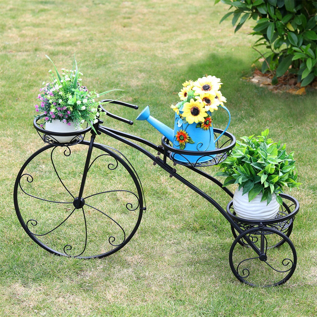 Black iron tricycle plant stand with space for artificial plants, designed for home and garden decor by Faux Flora.