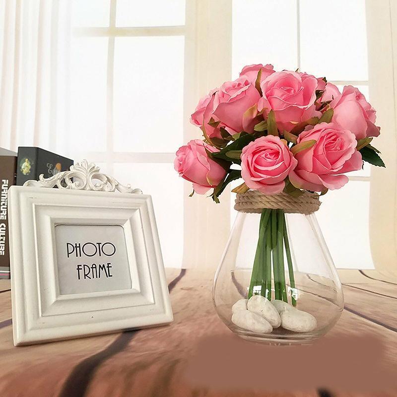 Set of twelve white silk rose artificial flowers from Faux Flora, perfect for home decor or garden arrangements.