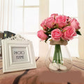 Set of twelve white silk rose artificial flowers from Faux Flora, perfect for home decor or garden arrangements.