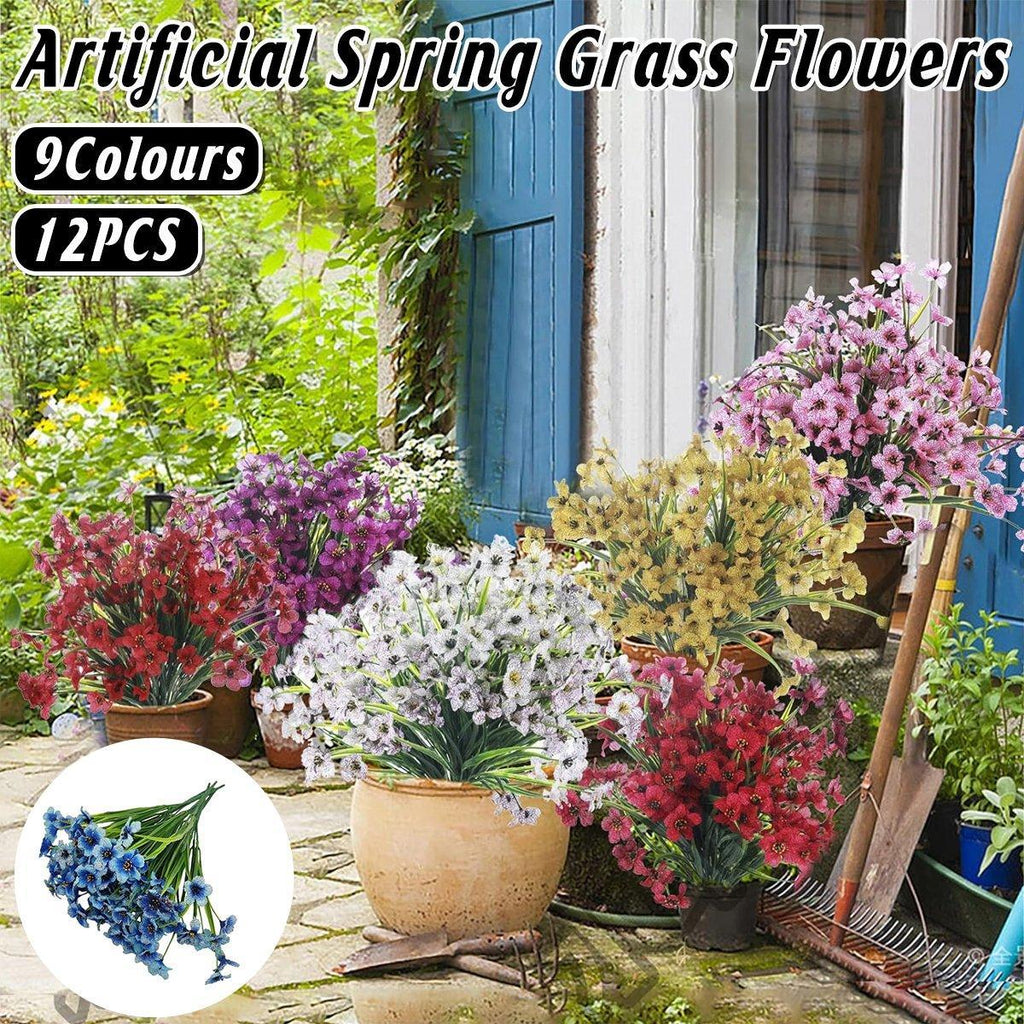 Set of twelve artificial orange spring grass flowers from Faux Flora, perfect for home and garden decor.