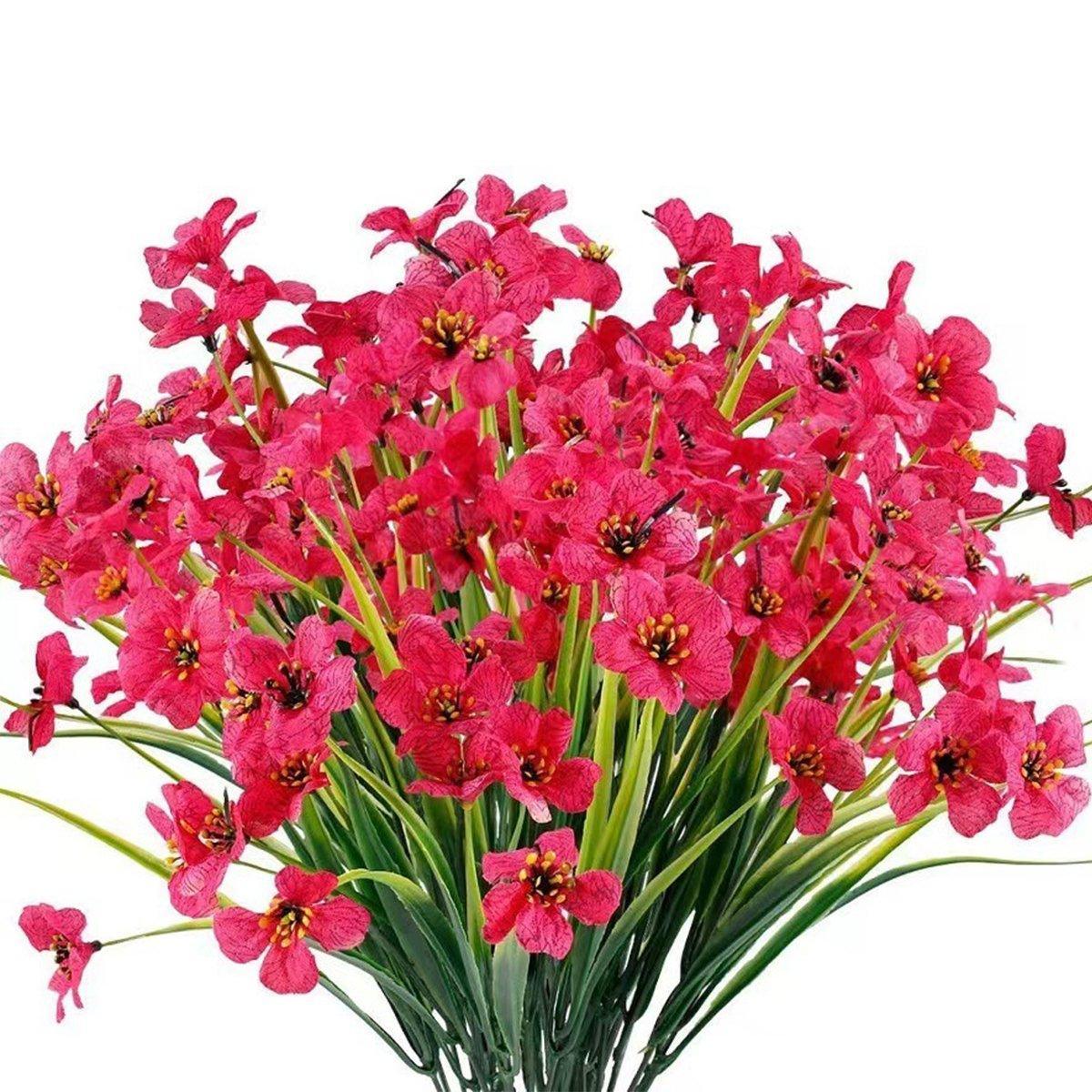 Set of twelve purple artificial spring grass flowers from Faux Flora, ideal for home and garden decoration.