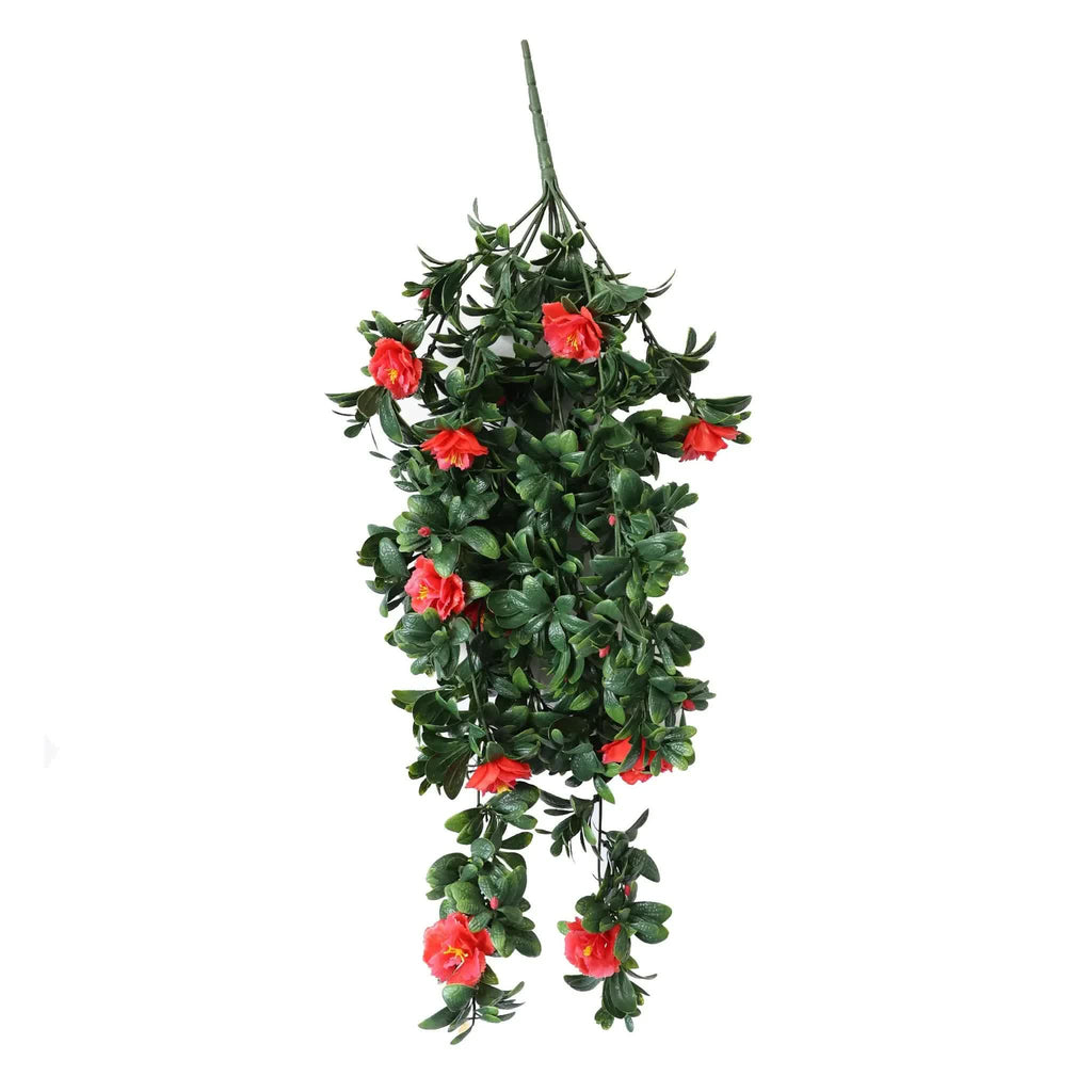 Artificial hanging plant with red flowers on a white background