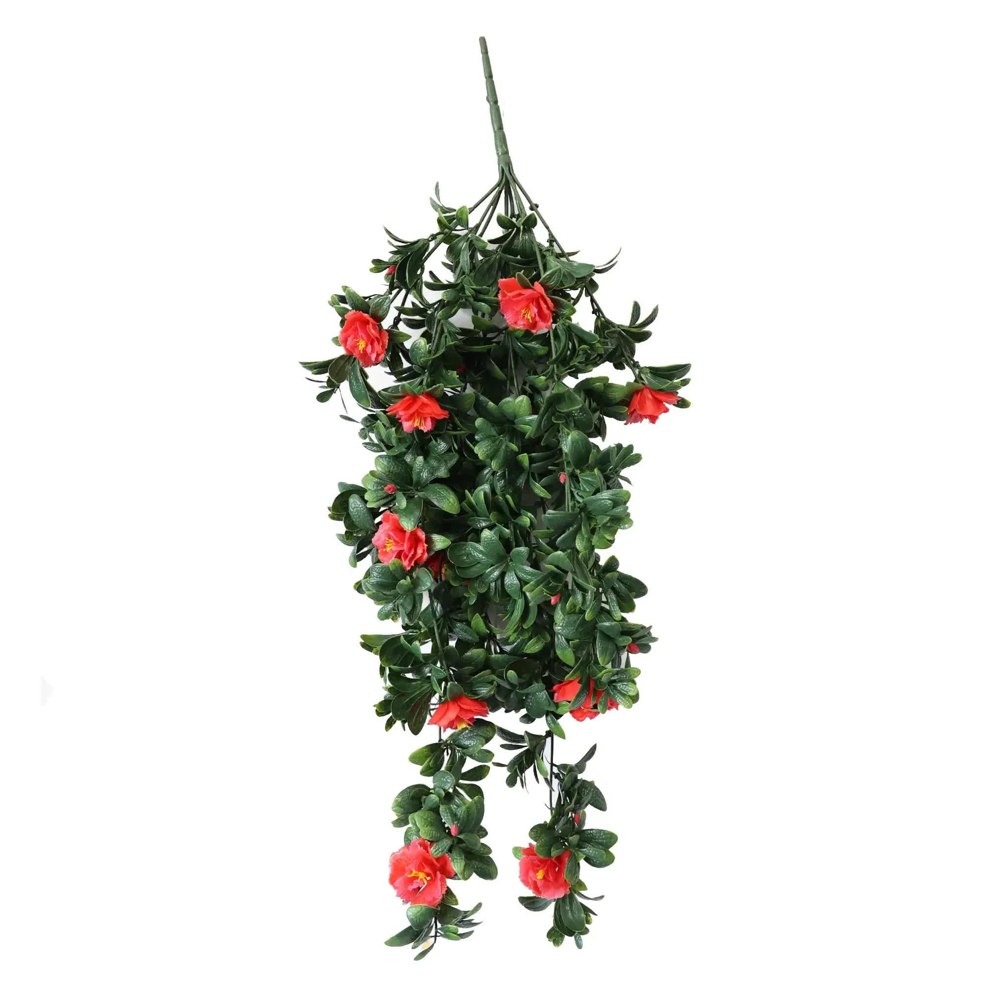 Artificial hanging plant with red flowers on a white background