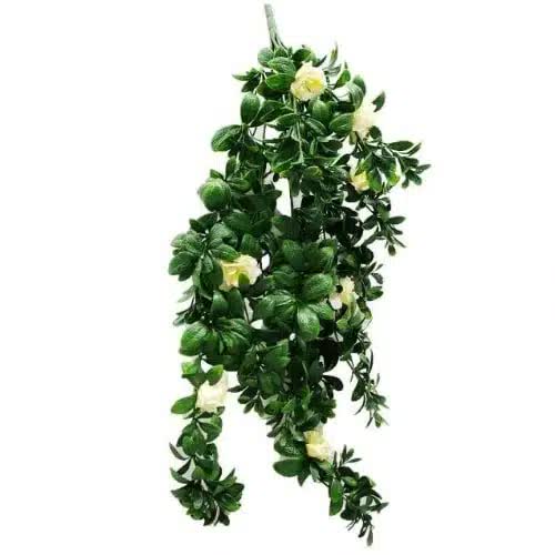 Artificial hanging plant with green leaves and white flowers on a white background