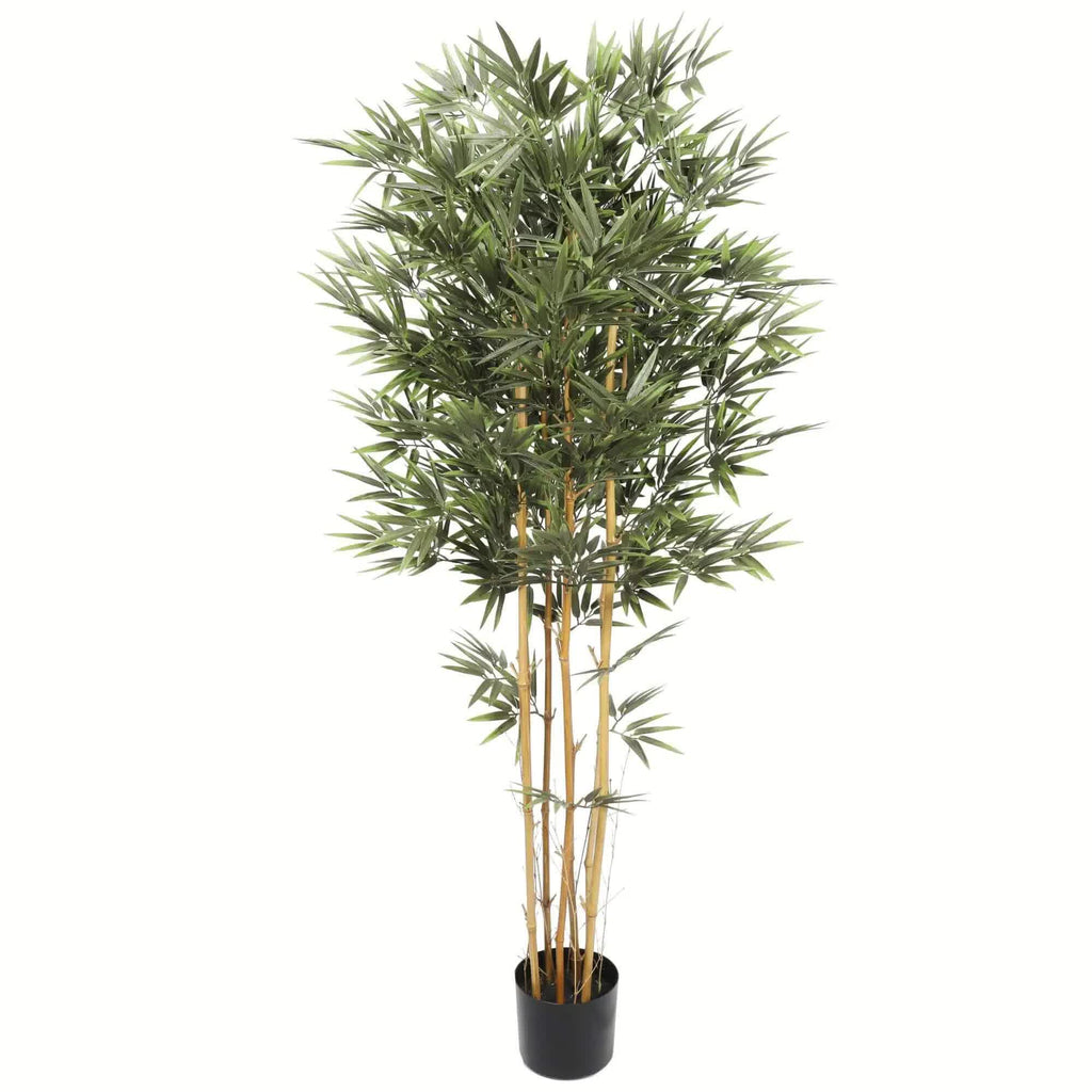 Artificial bamboo plant in a pot on a white background