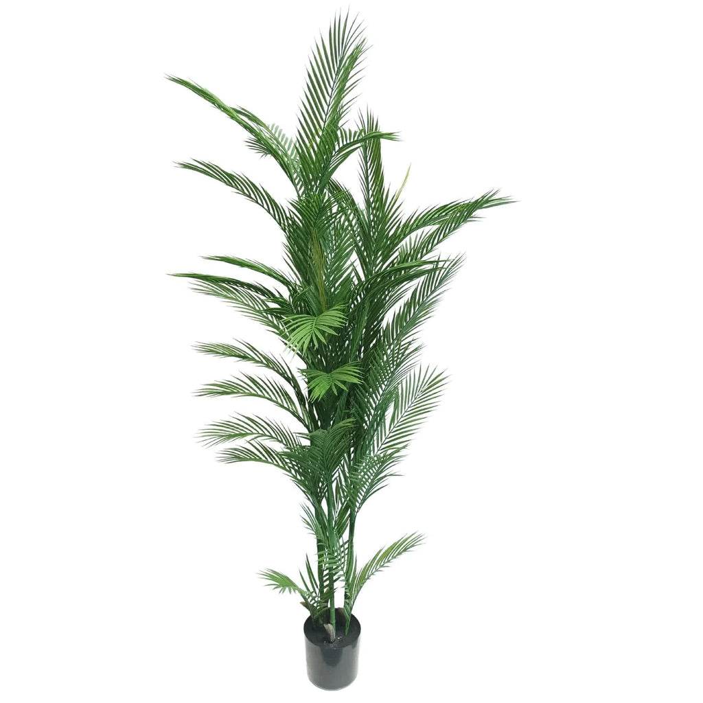 Potted artificial palm tree on a white background