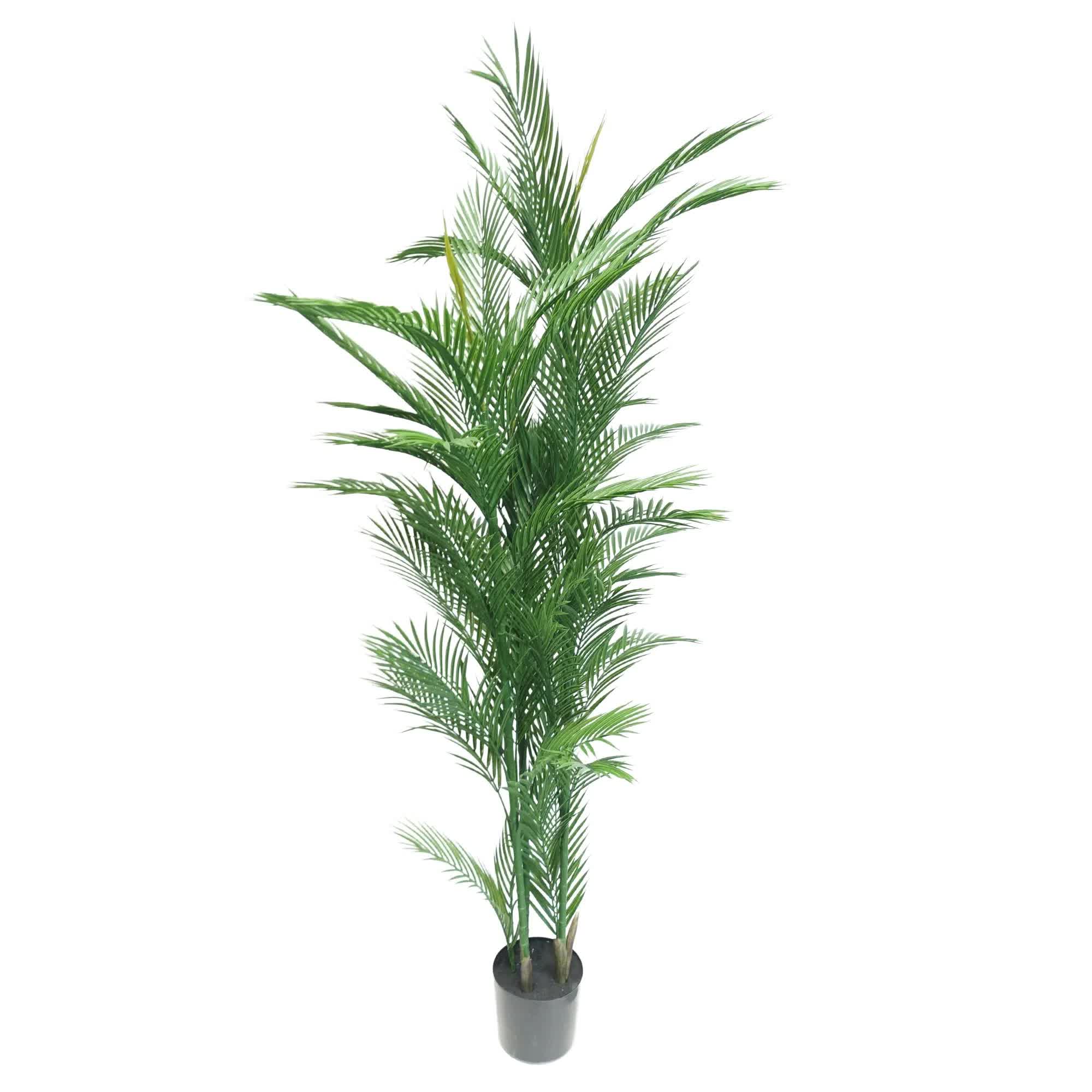 Potted artificial palm tree on a white background