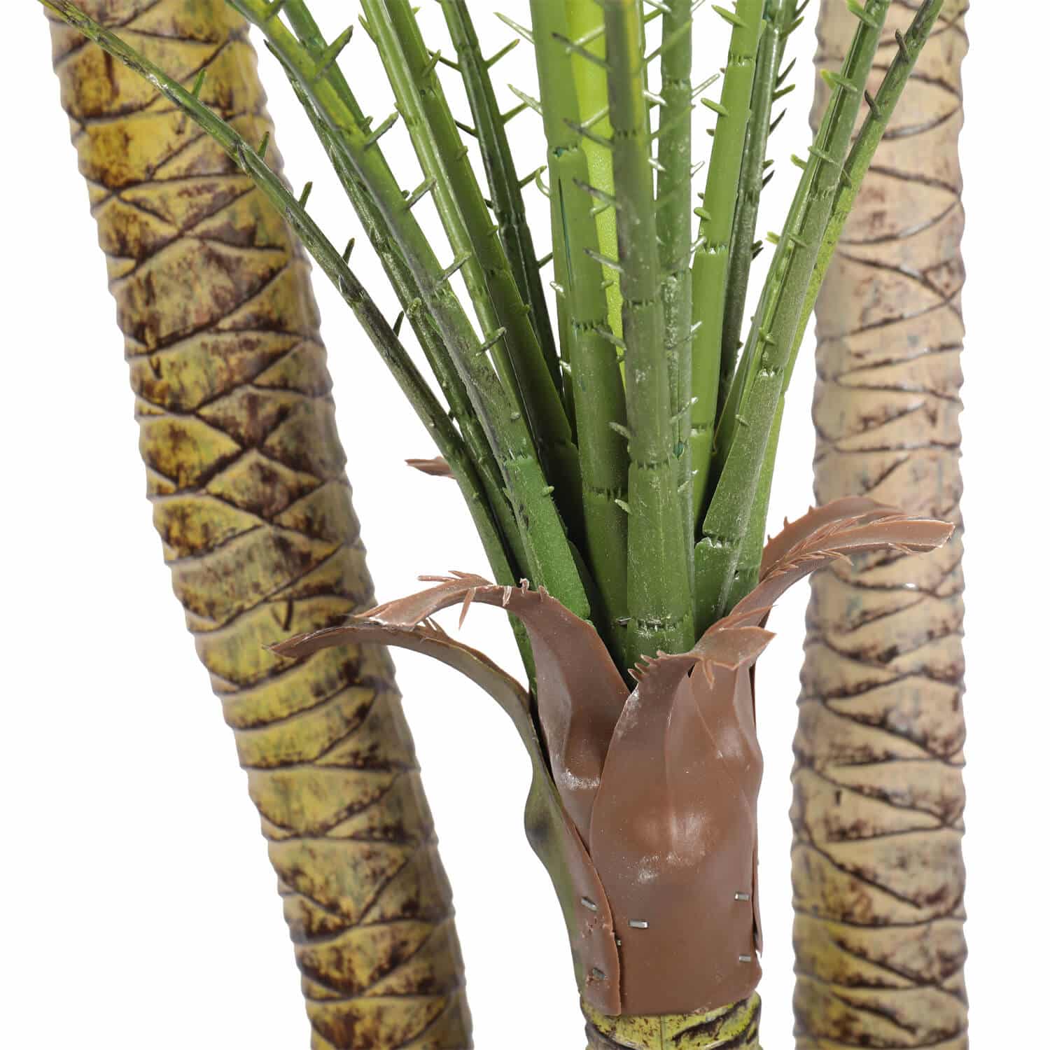 Artificial palm plant with brown leaves on a white background