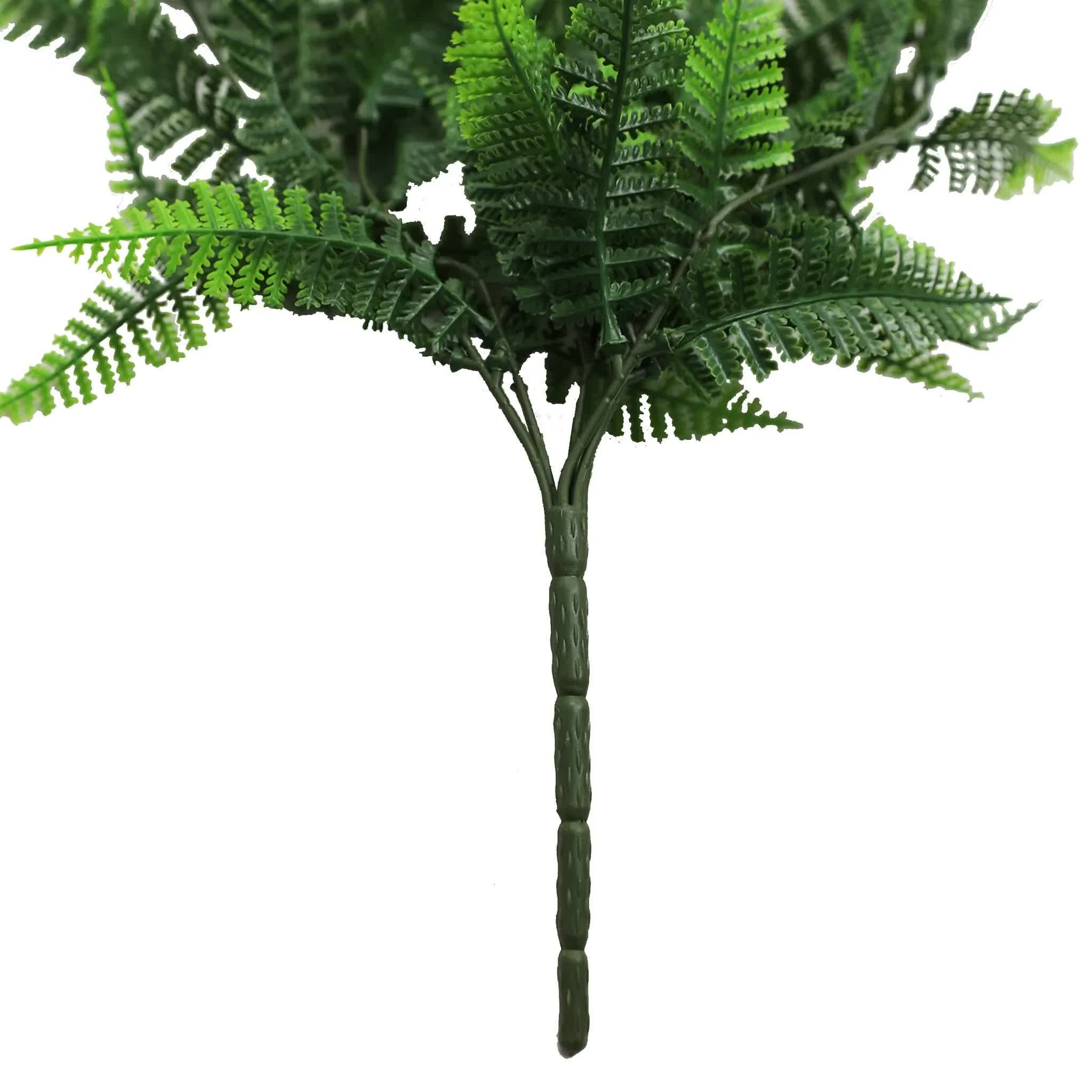 Artificial fern plant on a white background
