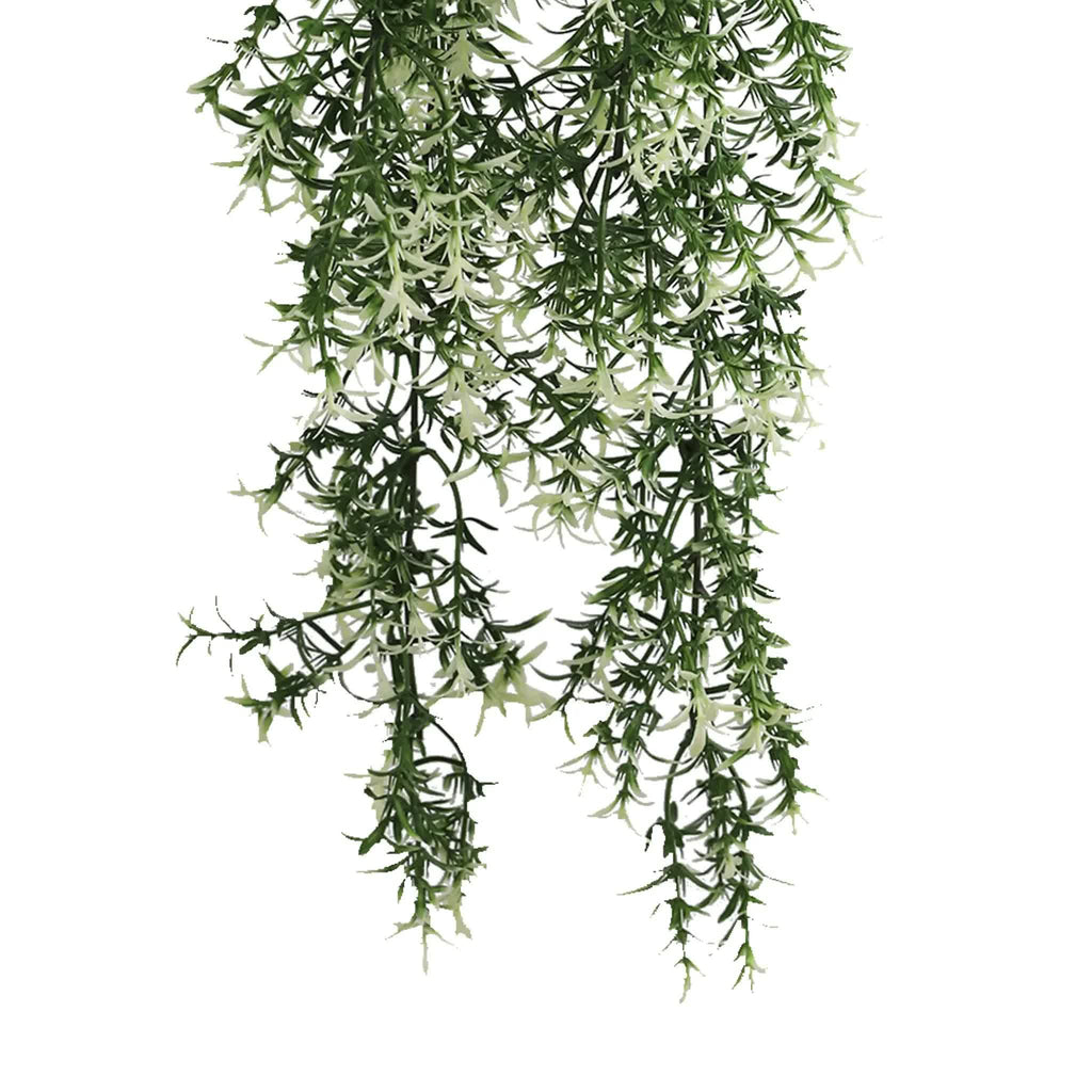 Artificial hanging plant with green leaves on a white background