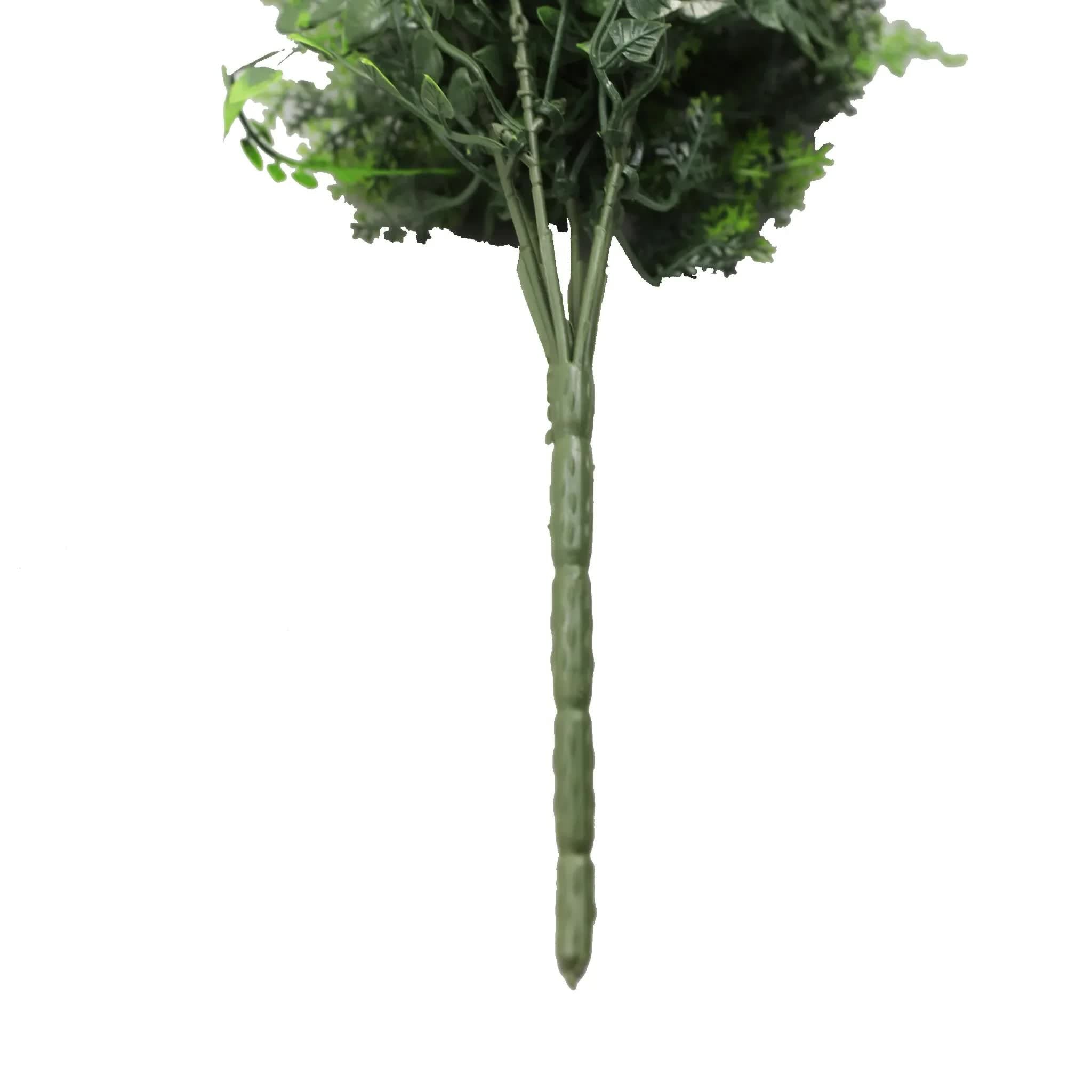Artificial green bush on a white background