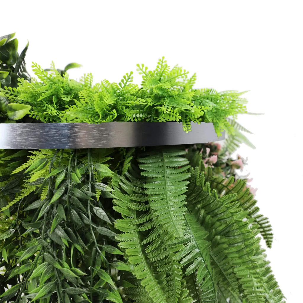 Artificial greenery with a metal shelf on a white background