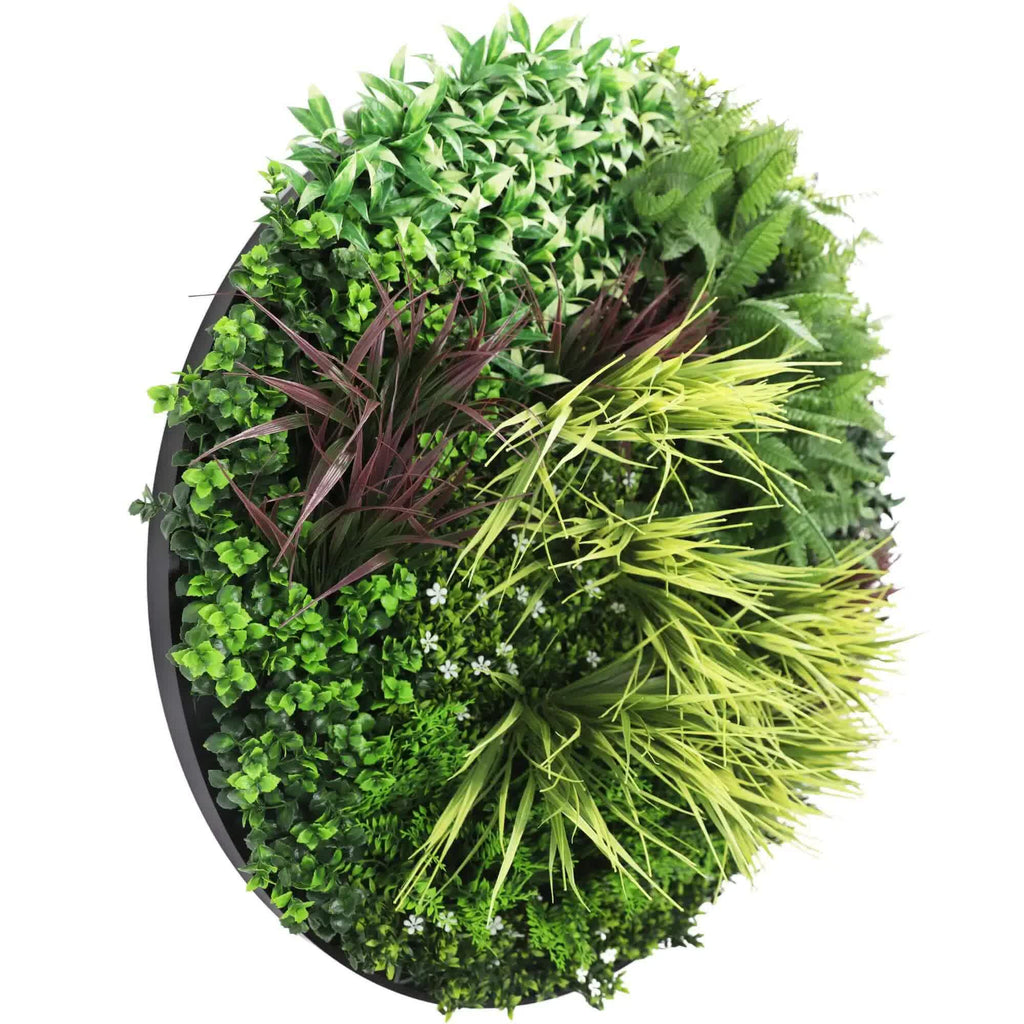 Artificial green wall disc art by Faux Flora, UV resistant black 100cm wall decoration with lush faux plant design.