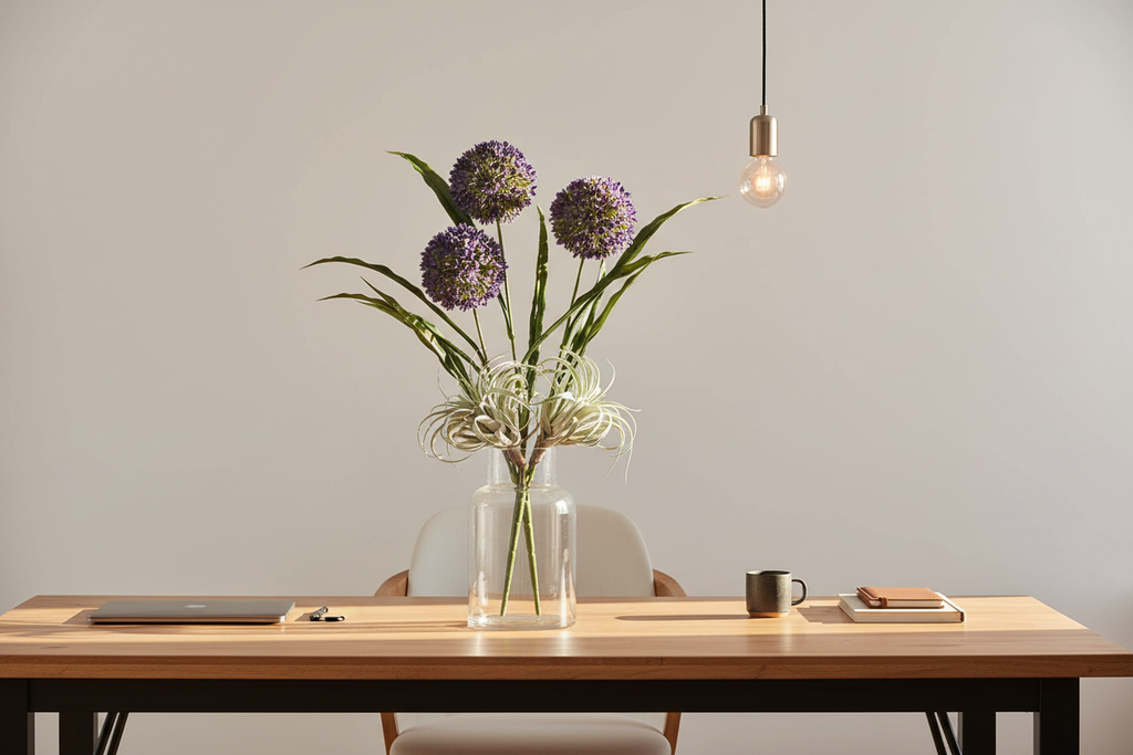 Home office – purple stems mixed with air plants on desk