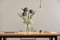 Home office – purple stems mixed with air plants on desk