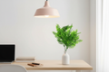 Home office – stems in small vase on timber desk